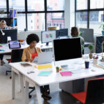 Modern office with people working diligently.