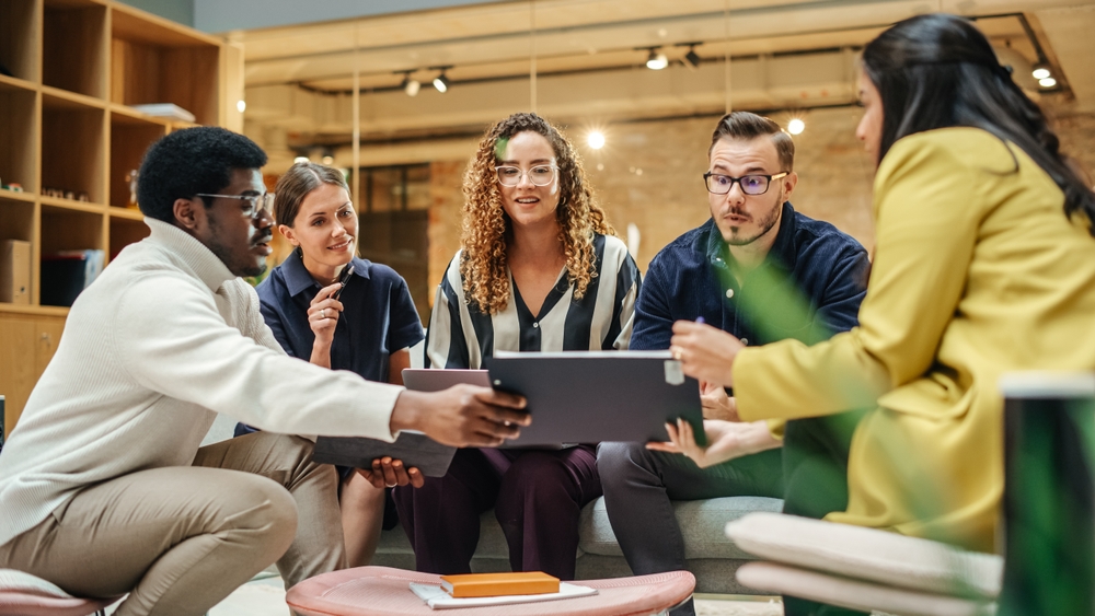 Group discussion in modern office setting.