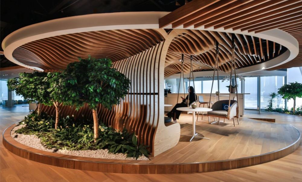 a room with a tree and a table