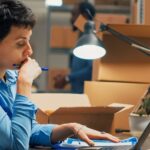 Person working at a desk with boxes