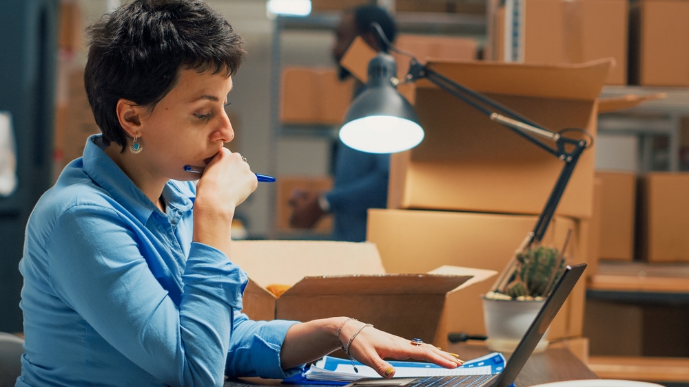 Person working at a desk with boxes