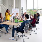 Group brainstorming in modern office.