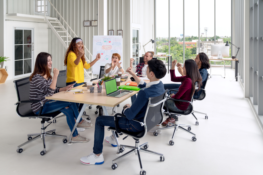 Group brainstorming in modern office.