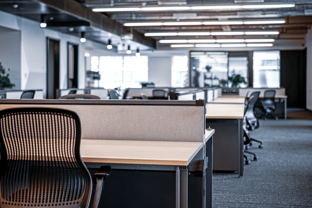 What is office hoteling? And is it similar to hot desking? Modern, empty office workspace interior