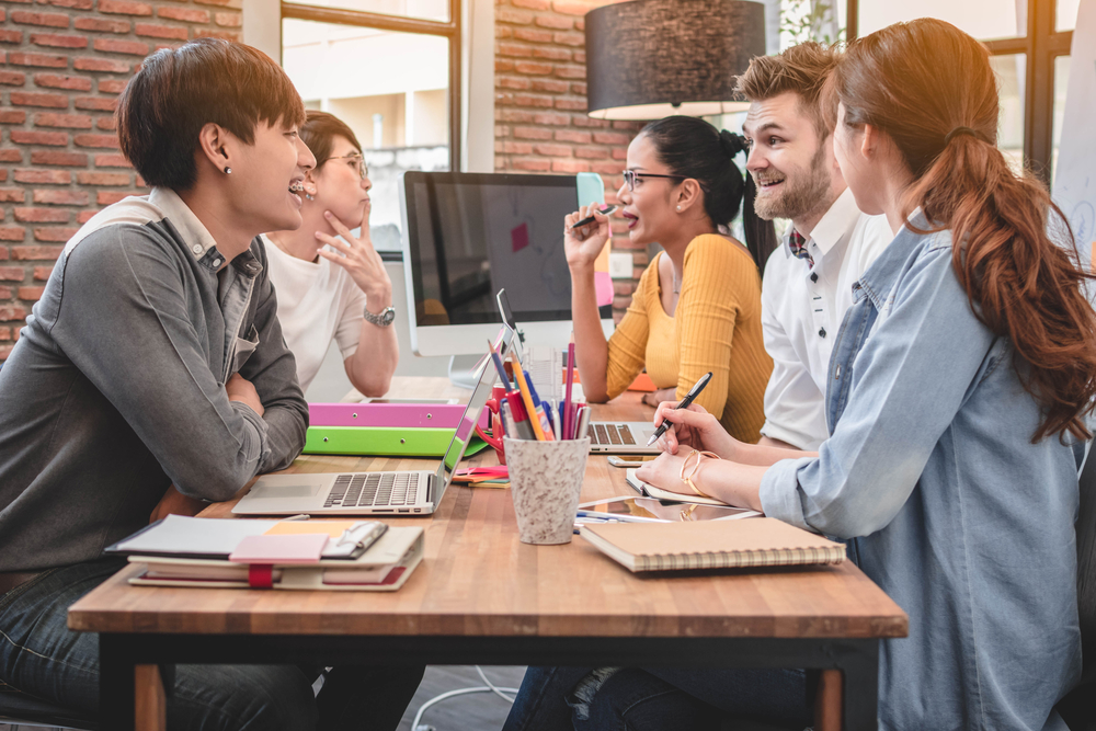 Group collaborating in a modern workspace.