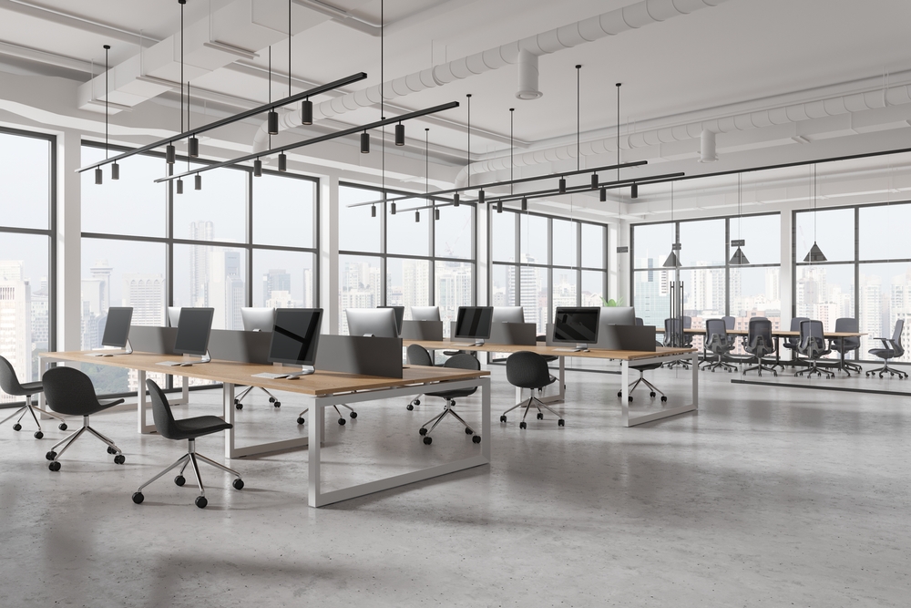 Hot Desk vs. Dedicated Desk – Find What’s Right For You Modern office with collaborative workspace design