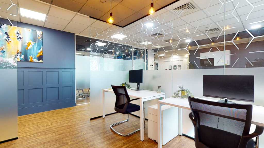 a room with white desks and chairs