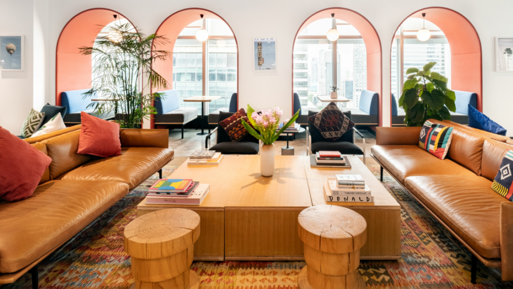 a room with a coffee table and chairs