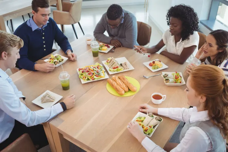 a group of people eating at a table