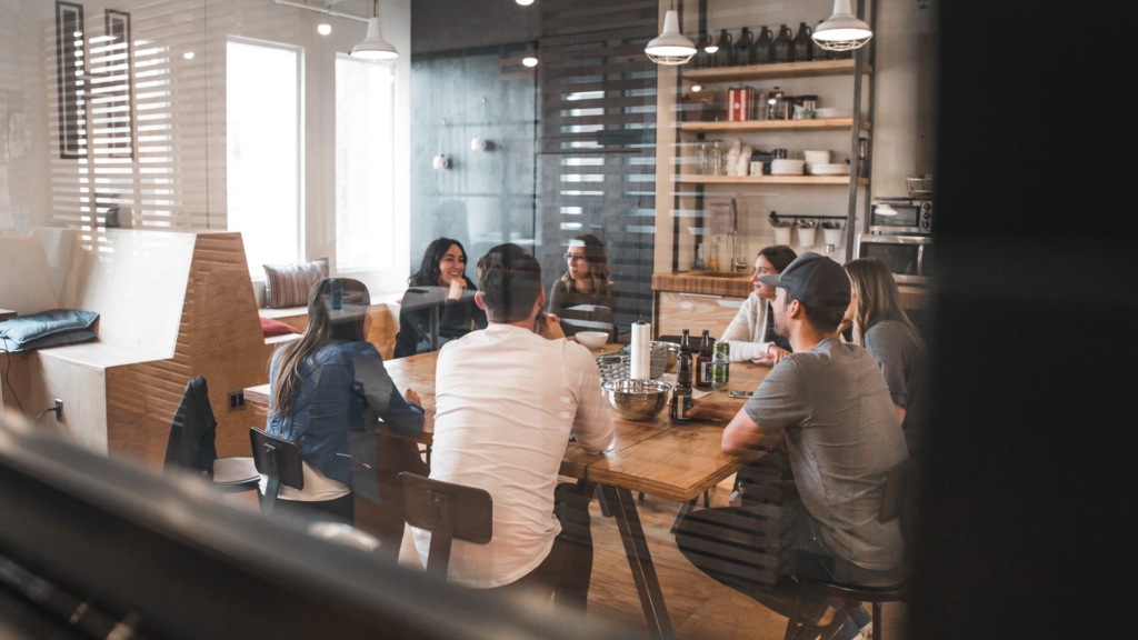 The benefits of daily office space rental a group of people sitting around a table