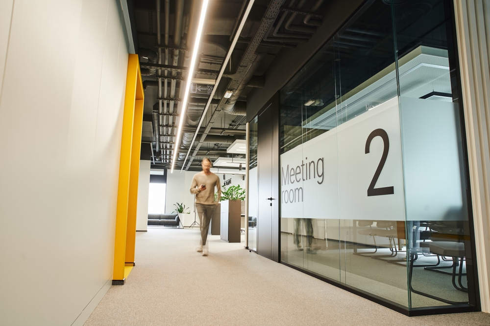 Modern office hallway with meeting room
