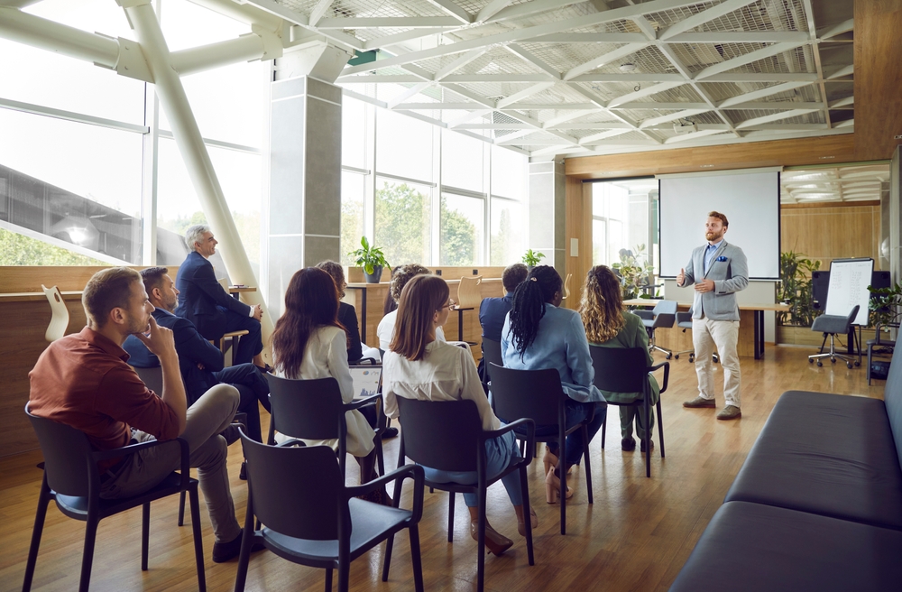 Business meeting in modern conference room.