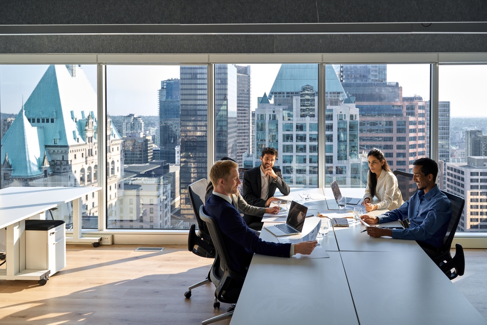 What is a collaboration hub? Modern office meeting with city view