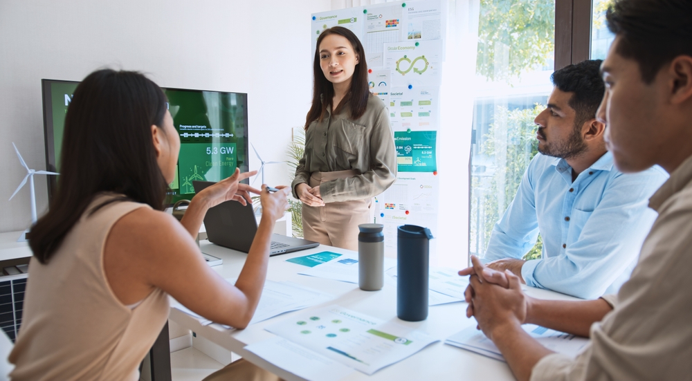 12 benefits of a collaborative workspace Business meeting with presentation and discussion.