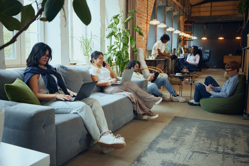 What is a collaboration hub? People working in a modern office.