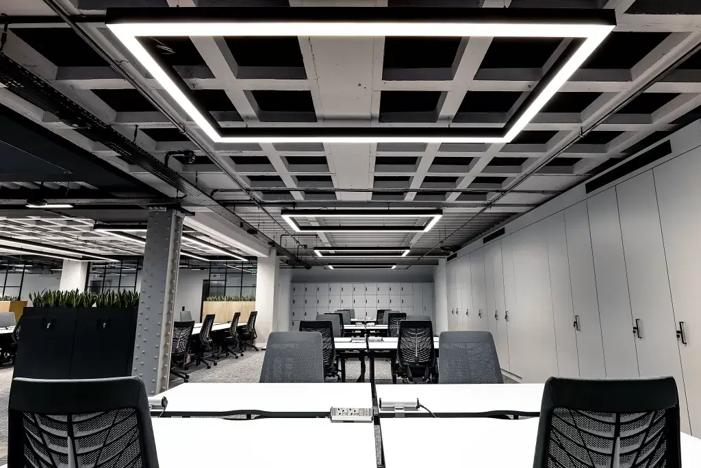 a room with white tables and chairs
