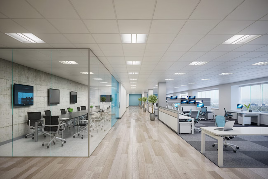 an office with a glass wall and a desk
