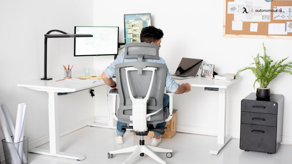 a man sitting at a desk with a computer