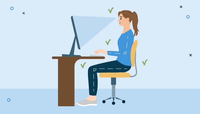 a woman sitting at a desk with a computer