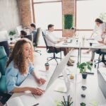 Modern office with people working collaboratively.